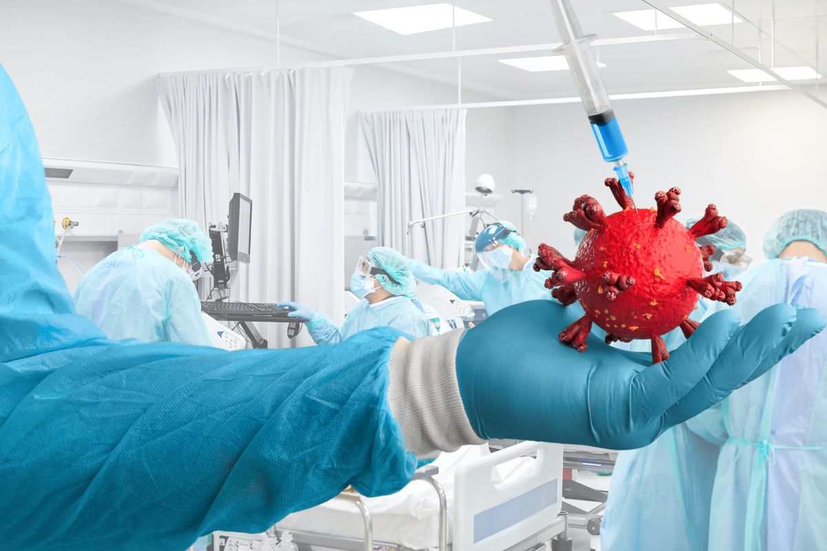 una siringa nel virus e dietro dei medici